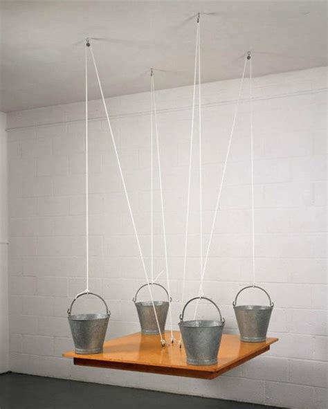 Heres A Table That Is Held By Buckets That Are On It Rpics