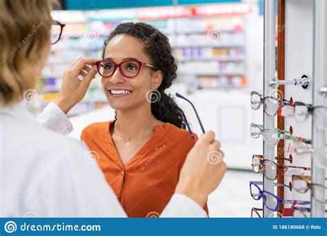 Optician Comparing Spectacles with Client Stock Photo - Image of people, pharmacist: 186180668