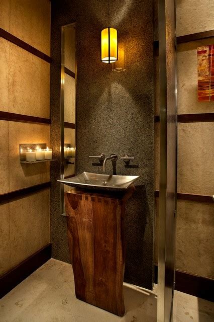In order to get more space for the powder room, the rear wall of the original chamber widened so that the sloping ceiling under the stairs to grow taller. 25 Modern Powder Room Design Ideas