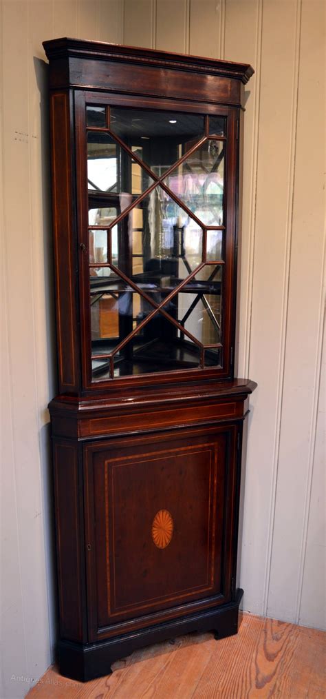 I used this piece of furniture for a new half bath that had no storage, but i didn't want something intrusive but had a nice empty corner for it. Inlaid Mahogany Corner Cabinet - Antiques Atlas