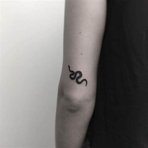 Beautiful Black Snake Tattoo On The Back Of The Left Upper Arm By Stick