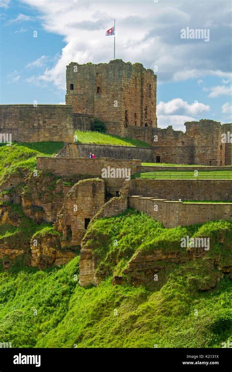 Ruins Of Historic Tynemouth Castle And Priory On Rocky Hill Under Blue