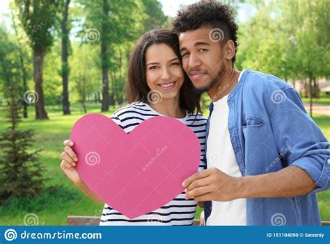 Happy African American Couple With Paper Heart In Park On Spring Day