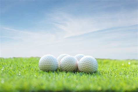 Premium Photo Golf Ball On Green Grass