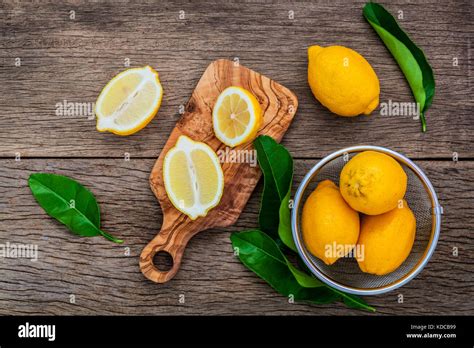 Fresh Lemons And Lemons Leaves On Rustic Wooden Background Fresh
