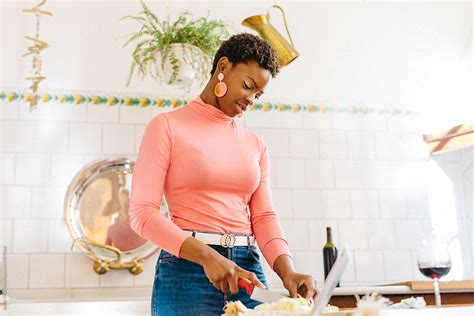 Black Woman Cooking In Kitchen By Stocksy Contributor Javier D Ez Stocksy