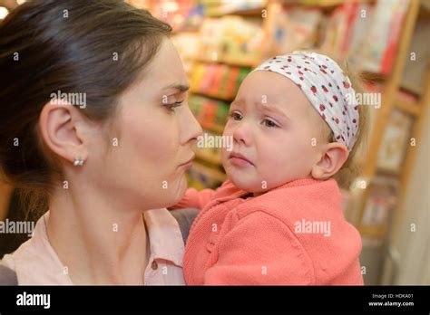 Mother Comforting Her Crying Little Girl Stock Photo Alamy