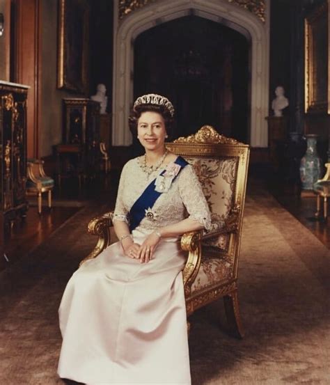 An Old Photo Of A Woman Sitting In A Chair Wearing A Tiara And Pearls