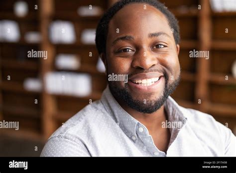 Close Up Portrait Of A Happy African American Young Man With Friendly