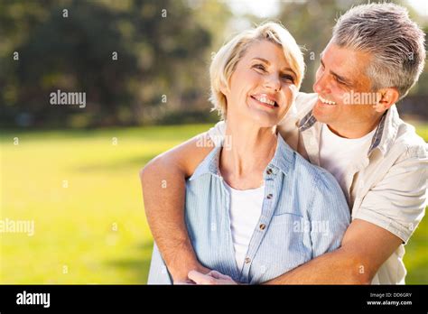 Cute Middle Aged Couple Embracing Outdoors Stock Photo Alamy