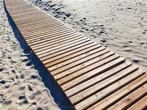 Wooden Walkway On The Sandy Beach Wooden Boardwalk And Light Soft Sand