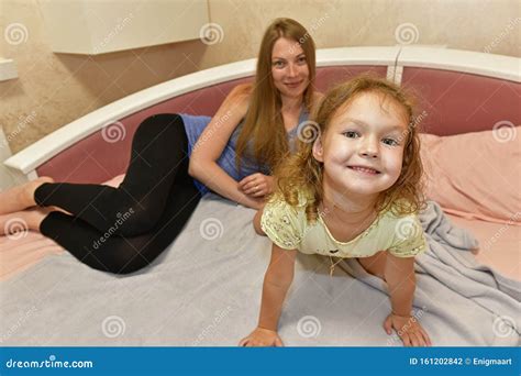 Aunt Puts Her Niece To Sleep In Bed Stock Photo Image Of Freedom