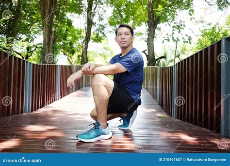 Smiling Handsome Asian Man Relaxing And Refreshing After Excercise And