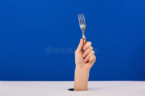 View Of Woman Holding Stainless Fork Isolated On Blue Stock Image