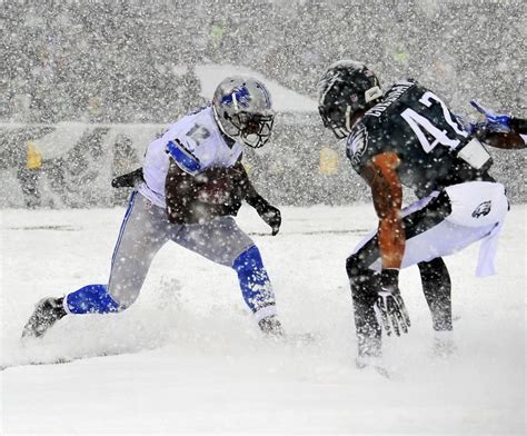 The Nfl Battles Snow And Ice Detroit Lions Football Lions Football