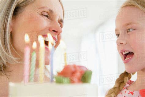 Senior Caucasian Woman And Granddaughter Celebrating Birthday Stock