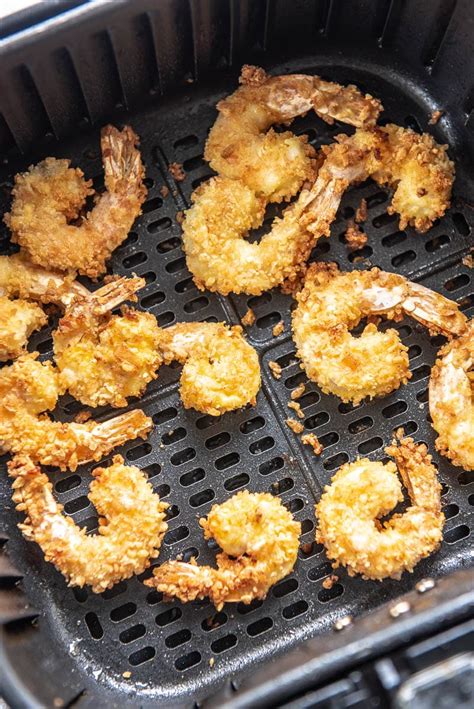 First you will want to have one bowl filled with flour, cornstarch and salt n pepper. Air Fryer Fried Shrimp - Garnished Plate