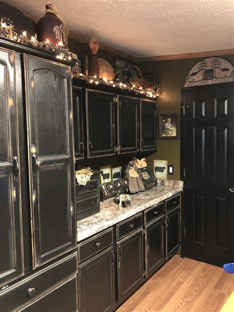 Be prepared for paint and sanding dust. Black cabinets Primitive style Distressed | Primitive ...