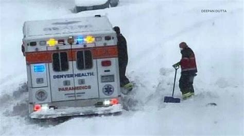 Neighbors Help Dig Out An Ambulance Stuck In Deep Snow
