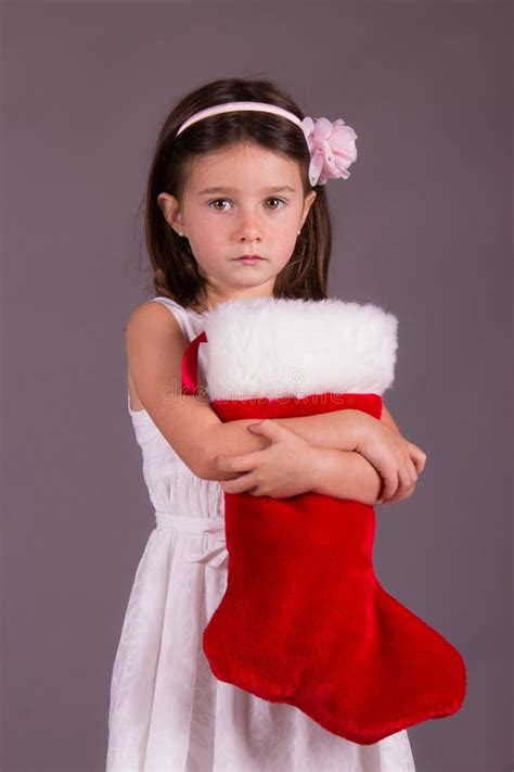 Sad Little Girl With Christmas Stocking Stock Image Image 33840357