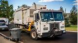 Garbage Trucks On Route In Action Photos