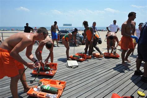 Lifeguards Rescue Man Who Collapsed In Shallow Water At Coney Island