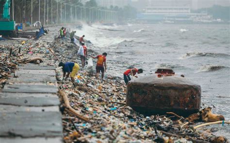 Shocking Photos Of Manila Streets Literally Flooded With Trash Show Why