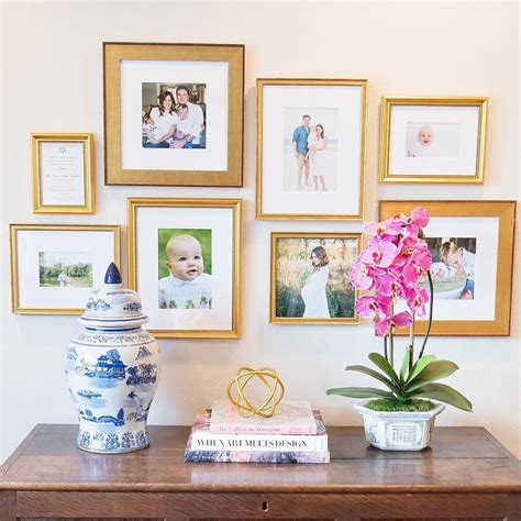 Gorgeous family photo gallery wall featuring a mix of gold frame styles, via the lovely Hous ...