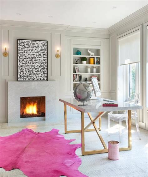 A Trendy Pink Cowhide Rug Adds A Pop Of Color In This