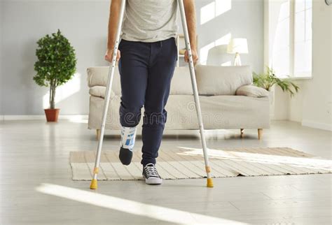 Unwell Man On Crutches With Bandage On Leg Stock Photo Image Of