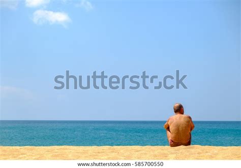 Man Sitting Alone On Beach Blue Stock Photo 585700550 Shutterstock