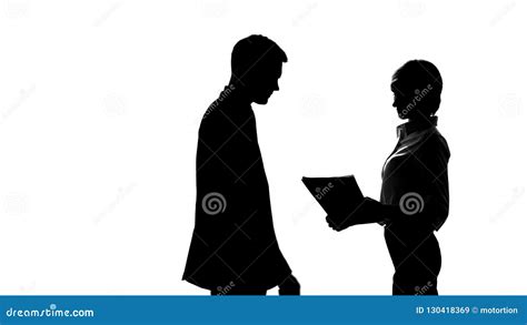Silhouette Of Female Secretary Showing Report To Boss In Office
