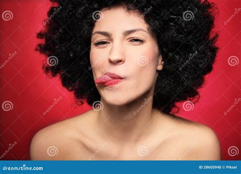 Woman With Afro Sticking Her Tongue Out Stock Photo Image