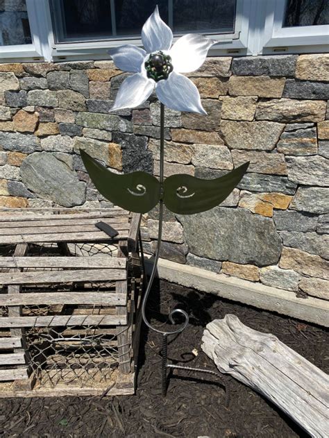 Install three aa batteries (not included) and set the on/off. Tall Outdoor Metal Flower