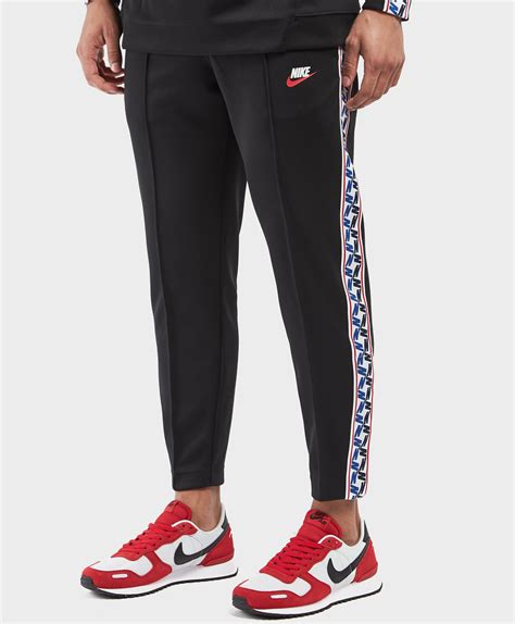 Nike Synthetic Taped Poly Track Pants In Black For Men Lyst