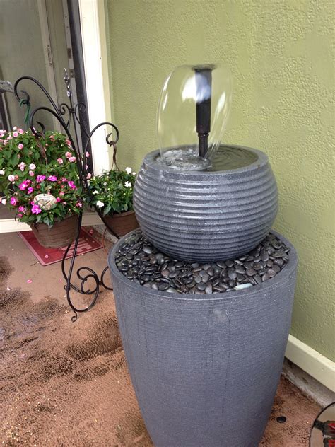 A Diy Patio Fountain Made From Flower Pots Rocks And A Water Pump