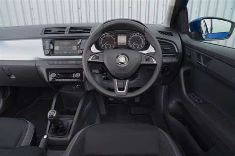 The fabia's dashboard layout and big switches couldn't be simpler to get to grips with, and se l trim adds a centre armrest as standard that's an option on the. Skoda Fabia Interior, Sat Nav, Dashboard | What Car?