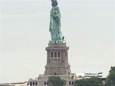 Person Scales Statue Of Liberty After Ice Banner Protest Guernsey Press