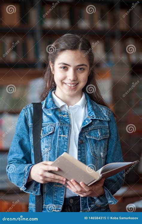 Beautiful Schoolgirl In The Library Reading A Book Stock Image Image Of Beautiful Schoolgirl