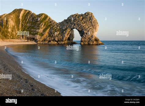 Durdle Door Is A Natural Limestone Arch On The Jurassic Coast Of Dorset