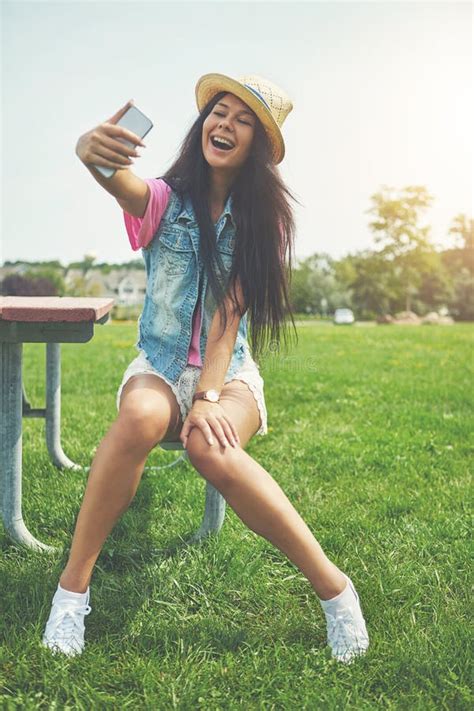 Sending You Lots Of Love An Attractive Young Woman Taking Selfies