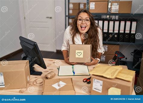 Young Hispanic Woman Working At Small Business Ecommerce Celebrating Crazy And Amazed For