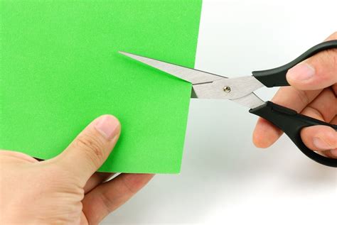 Cutting Paper With Scissors Paredro
