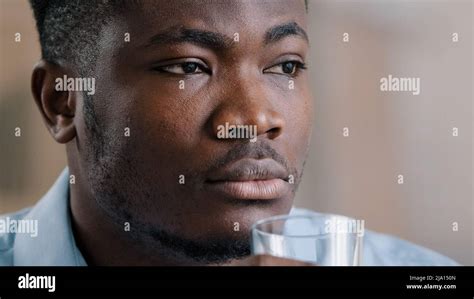Close Up Headshot African Millennial Man Drink Pure Fresh Cold Water
