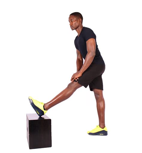 Fit Man Stretching Leg Muscles On Step Up Box