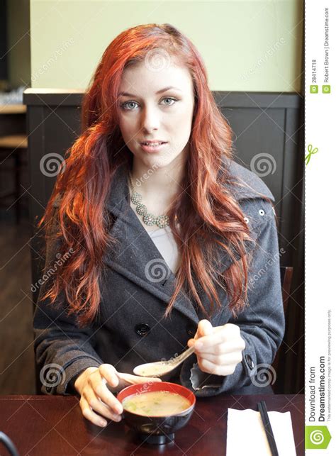 Auburn hair dimensions is a full service day spa. Young Woman With Beautiful Auburn Hair Eating Miso Soup ...