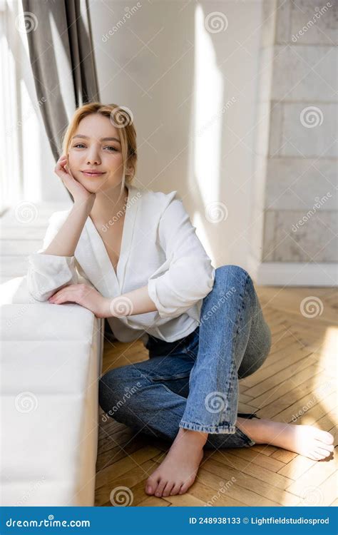 barefoot woman in jeans smiling at stock image image of caucasian barefoot 248938133