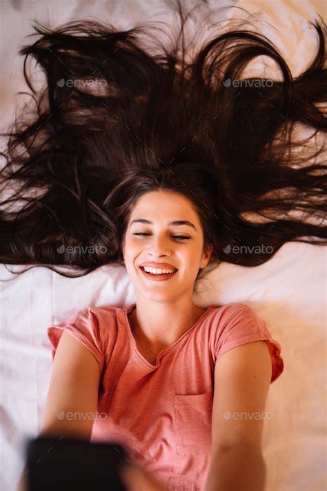 Beautiful Cheerful Brunette In Sleepwear Taking Selfie While Camera