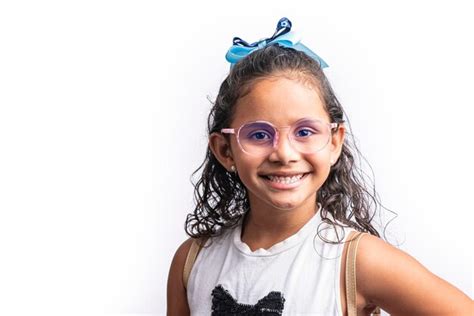 Premium Photo Portrait Of A Smiling Latina Girl With Glasses Looking