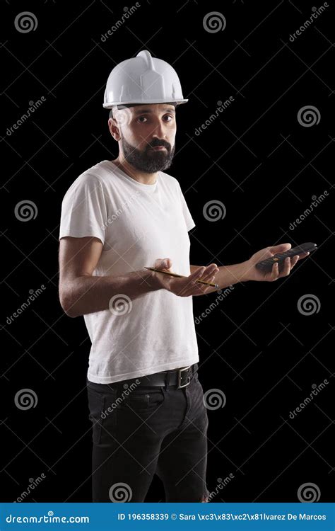 Confused Young Male Construction Worker Looking At Camera Stock Image